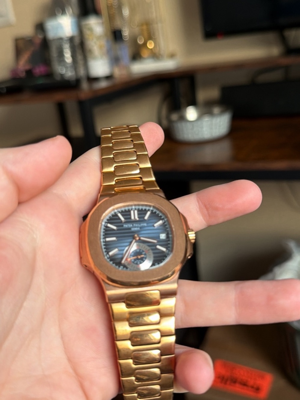 Patek Philippe Gold and Black Nautilus-Style Bracelet Watch